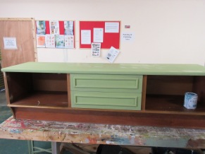 Rustoleum Sage Green chalk paint is applied to surround and middle drawers. The magic of chalk paint is that is doesn't require any sanding or primer.
